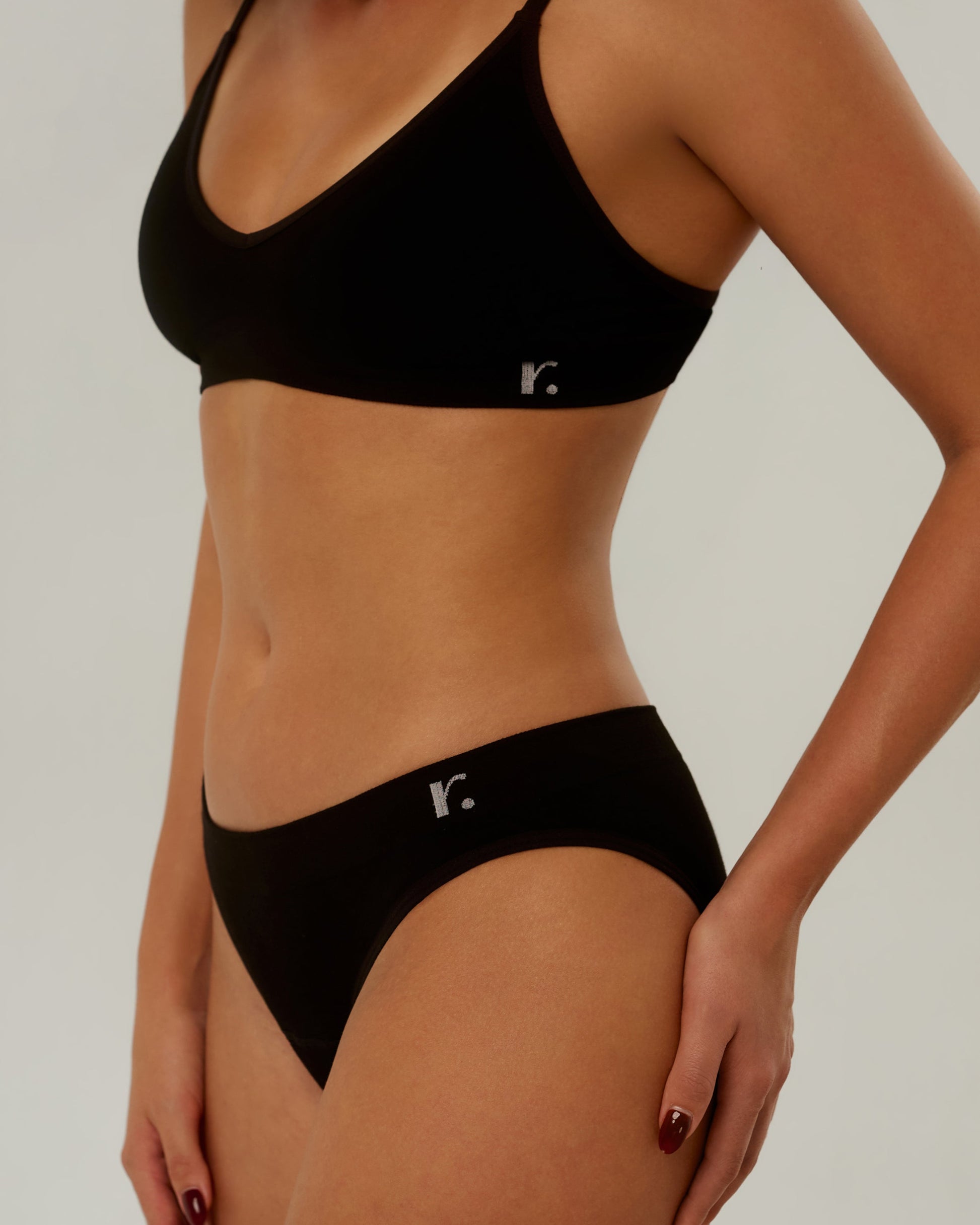 Rudie Leakproof Period Brief in black, half-body side view — comfortable seamless period brief