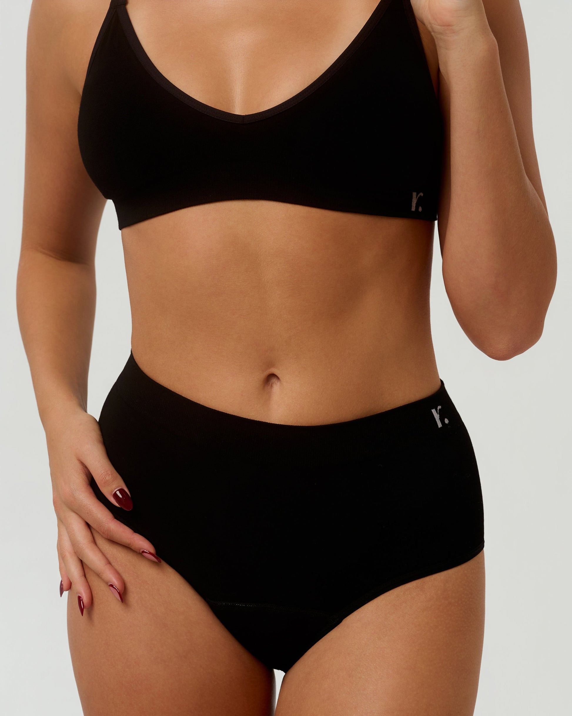 Rudie Leakproof High-Waist Brief in black — front half-body view, seamless bamboo coverage