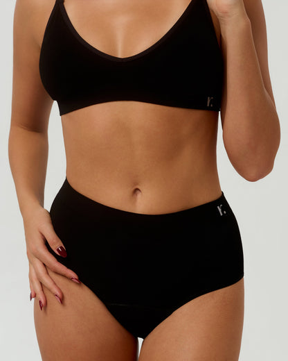 Rudie Leakproof High-Waist Brief in black — front half-body view, seamless bamboo coverage